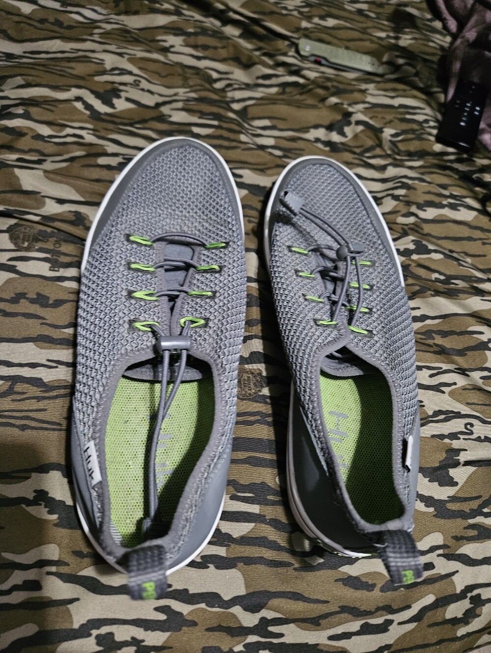 These are Huk Rogue Wave shoes in gray with lime green accents